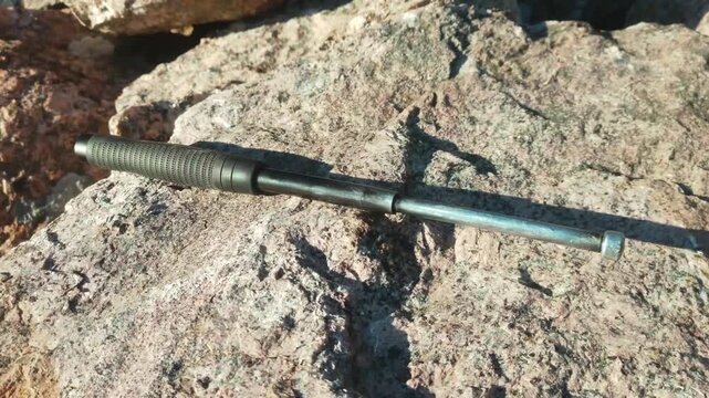 metal telescopic baton for self-defense. impact weapon