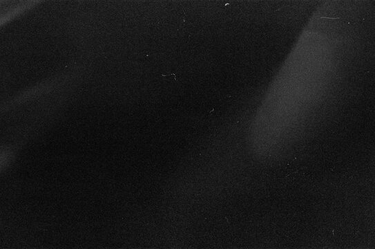 Dusty scratched and scanned old film texture, light leaks overlay effect. Retro analog cinematic flare. 