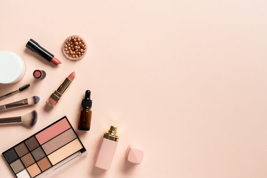 Make up products. Shadow palette with brushes, lipstick, cream and others.