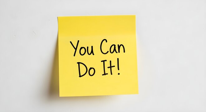 A single, yellow sticky note with the handwritten words "You Can Do It!" on a white wall.
