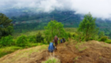 Obraz premium Blurred of People Hiking Down from Kembang Mountain Indonesia