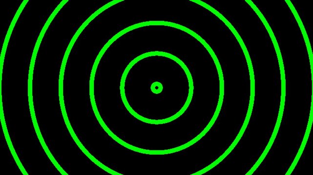 Concentric green circles radiating outwards on a black background, creating a sense of motion and energy.