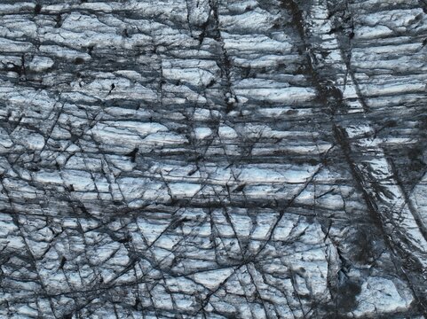 Aerial view of glacier ice with deep crevasses and textured surface patterns Kalfafellsstadur, Sveitarfelagid Hornafjordur, Iceland.
