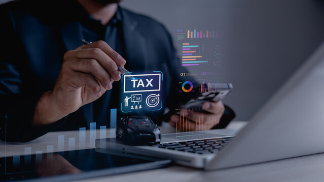 gst vat tax taxation.Business professional reviewing GST and VAT tax data on digital devices with financial charts, representing taxation, compliance, accounting and strategic financial reporting.