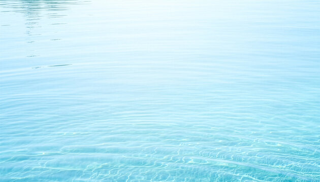 Calm clear light blue water surface with gentle ripples texture 穏やかなライトブルーの水面に広がる細やかな波紋のテクスチャ背景