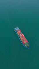 Fototapeta premium Aerial view from a container drone. Container ships in export-import and logistics business Transporting goods to large ports Worldwide shipping and logistics business International business abroad