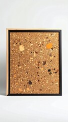 Fototapeta premium Framed textured artwork with a mosaic of colorful chips on a warm brown background