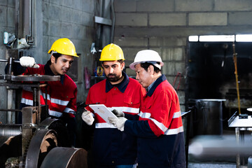 Fototapeta premium Teamwork in industry with professional mechanics checking product quality using caliper.