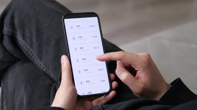 Mobile app interface showing real-time USD exchange rates against multiple major currencies. Clean list format with flags and values. Detailed view for CNY at 7.234. Perfect for videos about currency
