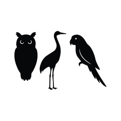 Obraz premium Set of bird silhouettes including an owl, a crane, and a parrot