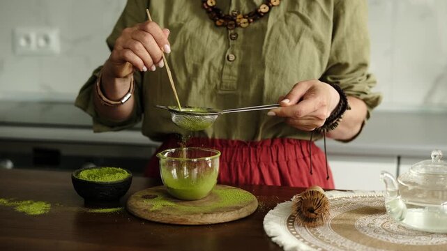 Woman Preparing Matcha Green Tea Close-Up View Sifting Tea