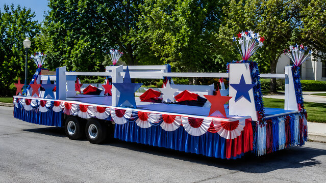 Patriotic parade float decorated in red white and blue