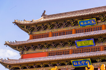 Fototapeta premium Datong, China - May 9 2026: The imposing façade of Datong Drum Tower showcases traditional Chinese architecture with elegant wooden construction, layered roofs, and enduring historical grandeur