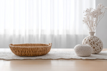 Fototapeta premium Still life minimalist decor with woven basket, crochet runner and dried flower arrangement on wooden table