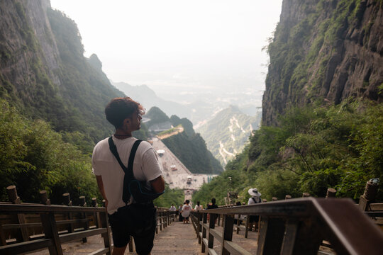 Traveler looking down the stairs of Heaven's Gate