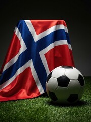 Fototapeta premium Norwegian flag and soccer ball on green grass