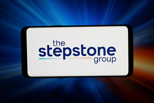 Stuttgart, Germany - 06-17-2026: In this photo illustration, the logo of German company The Stepstone Group GmbH is displayed on a smartphone in front of abstract background on computer screen.