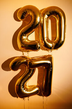 Gold foil balloons forming 2027 for new year celebration