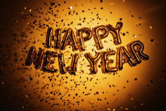 Gold balloons spelling happy new year celebration