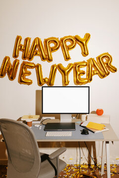 Desktop computer mockup with white screen and happy new year balloons