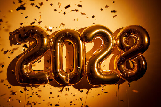 Gold 2028 balloons with confetti for new year celebration