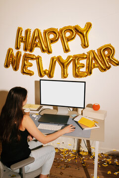 Desktop mockup with blank screen in happy new year office