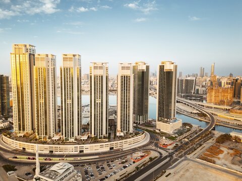 Abu Dhabi, UAE - 25th april, 2025: Abu Dhabi capital city UAE skyline with real estate buildings sunrise panorama with clear blue sky. Business real estate marina heights copy space banner