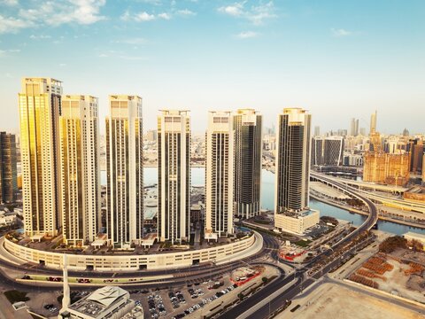 Abu Dhabi, UAE - 25th april, 2025: Abu Dhabi capital city UAE skyline with real estate buildings sunrise panorama with clear blue sky. Business real estate marina heights copy space banner