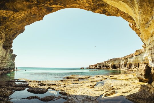 Sea cave arch viewpoint near Cape Greko, Capo Greco, Ayia Napa and Protaras on Cyprus island, Mediterranean Sea. Breathtaking seascape. Turquoise crystal clear waters in sunny day