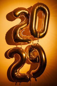 Gold foil balloons forming 2029 new year numbers