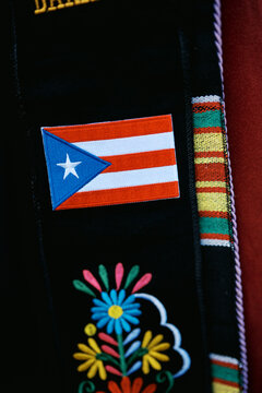 embroidery on graduation regalia of a Latina Puerto Rican doctorate 