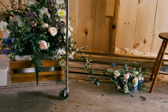 flower arrangements for wedding in a florist studio on rolling cart