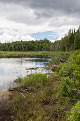 Fototapeta premium Sky clearing canoe launch site over Park Lake near Algonquin Park in Ontario in summer
