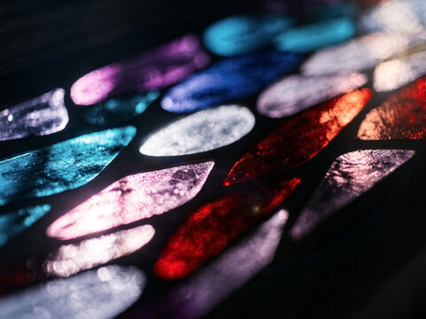 A Colorful Abstract Light Pattern with Glowing Reflections on a Dark Surface