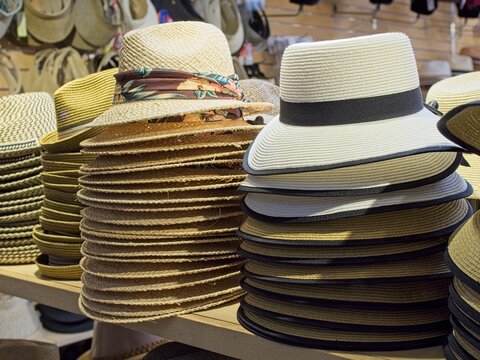Stacks of hats in store window display