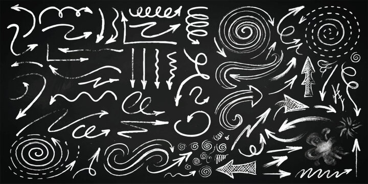 Set of hand drawn chalk arrows and doodle elements on black chalkboard background