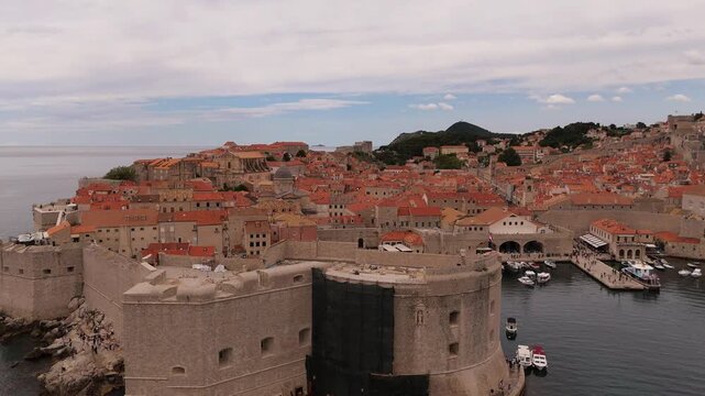 Dubrovnik St Johns Fortress and old port with boats below Srd hill