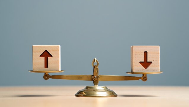 Balancing act with wooden cubes showing contrasting upward and downward arrows