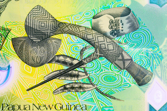 2 Kina Papua New Guinea with the image of Mount Hagen axe, Kula arm band from the Milne Bay Province, engraved dog's teeth from the Bougainville are. Polymer money Papua New Guinea.