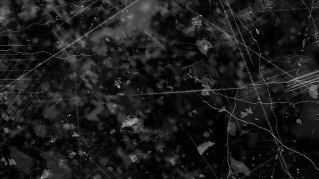 Abstract dark black grunge texture with subtle scratch patterns and distress overlay.