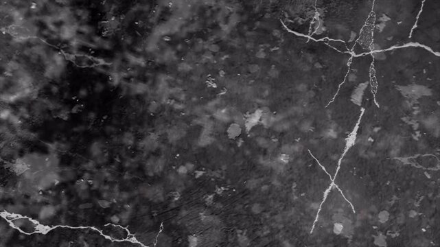 Elegant dark grey marble stone surface texture with natural white veining patterns.