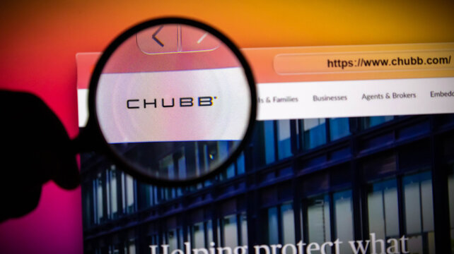 Closeup of a magnifying glass over the chubb insurance company website logo