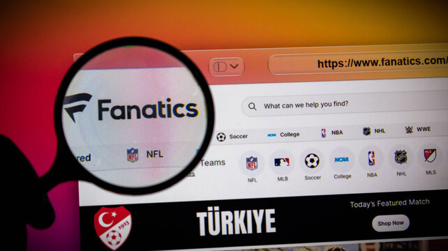 Closeup of a magnifying glass over the fanatics website on a computer screen