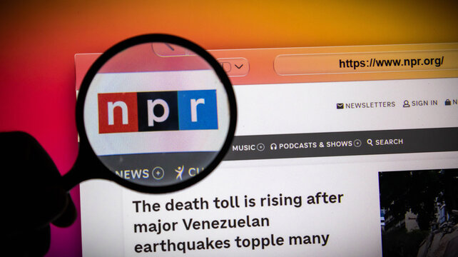 Magnifying glass over the npr logo on a computer screen