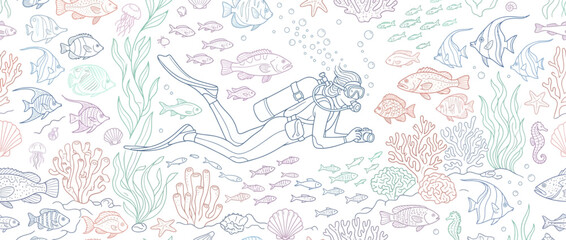 Obraz premium Scuba diver swimming among colorful coral reef and fish.