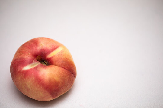 Delicious Donut Peach on light pink background in the corner