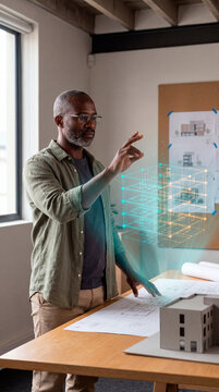 Engaged Architect Analyzing Holographic Structural Node