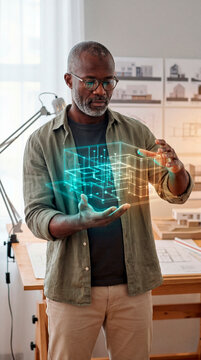 Focused Architect Presenting Holographic Building Model