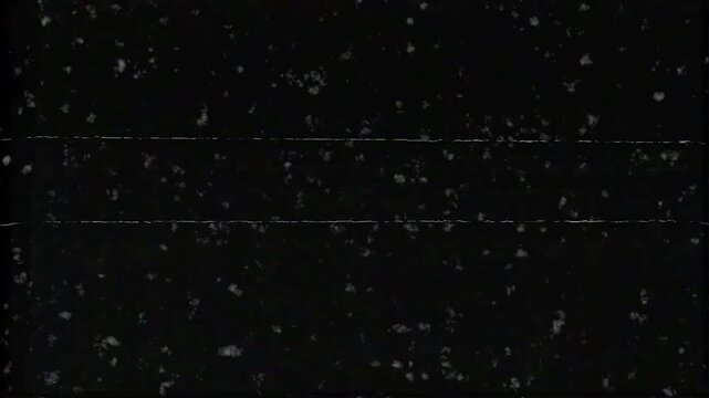Old film tape defects grainy film texture with flickering dust and static lines. Suitable for adding a vintage feel or mystery to projects.