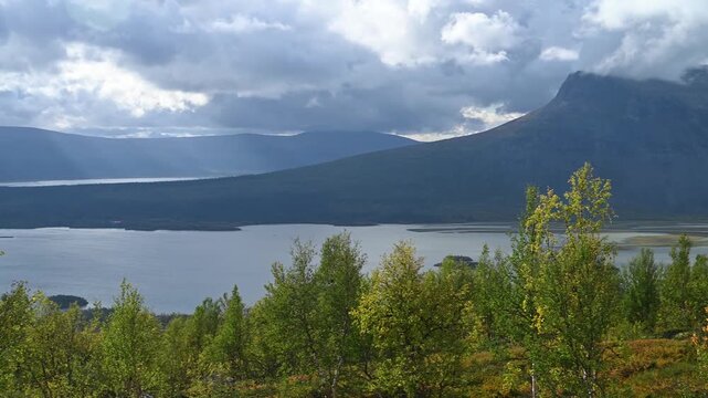 Moody Stormy Sky Over Mountain Lake and Birch Forest in Sarek National Park, Swedish Lapland